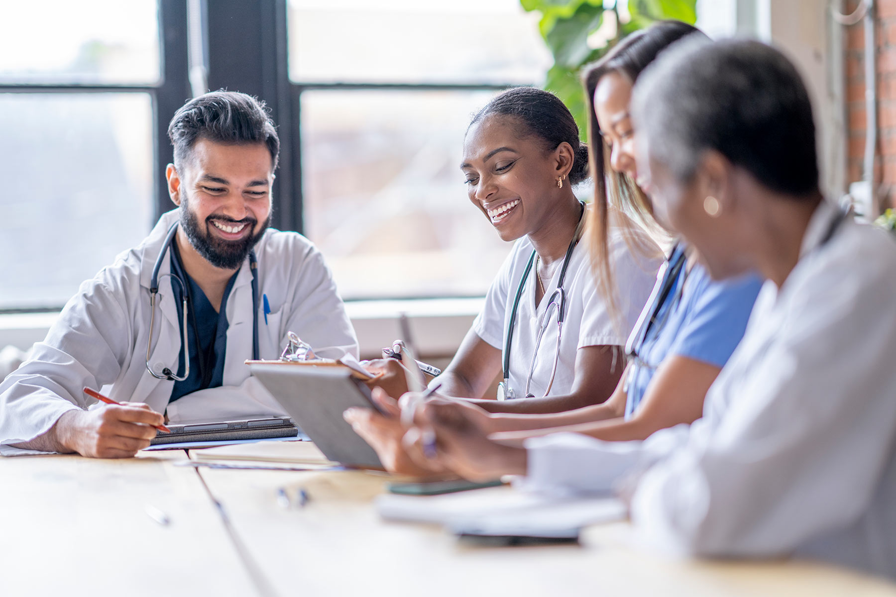 Four smiling providers